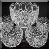 G11. Pressed glass footed serving bowl with 6 matching smaller bowls. - $18 